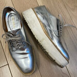 Prada silver platform loafers